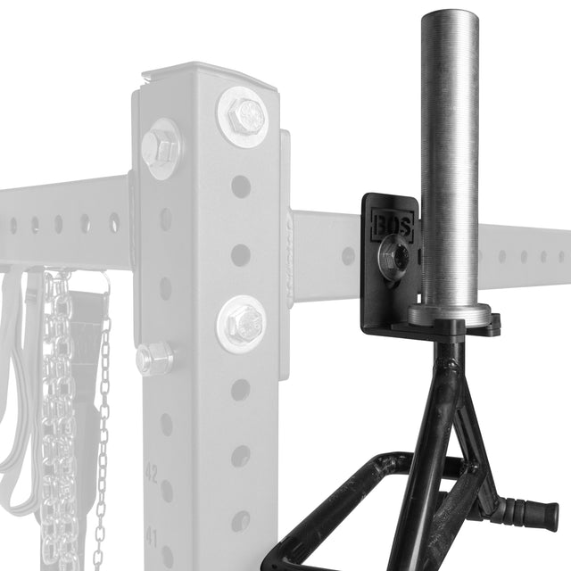 A close-up of the Bells of Steel Hanging Barbell Holders mounted on a steel gym rack, with a black handle partially visible and the rack and background faded to highlight this storage accessory.