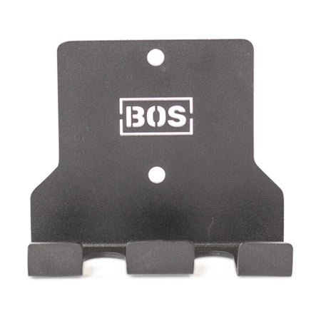 The Bells of Steel Hanging Barbell Holders are black metal wall hooks with three prongs and two mounting holes, featuring the BOS logo in white—perfect for organized storage and easy installation with compatible hardware.