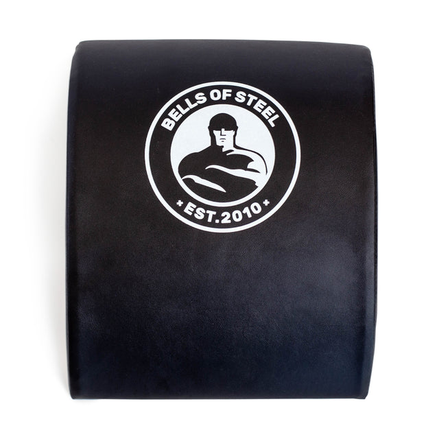 The Bells of Steel Sit Up Mat, in black and ideal for core workouts, showcases a white muscular figure logo with "Bells of Steel" and "EST. 2010." It offers excellent lumbar support as a sit-up mat.