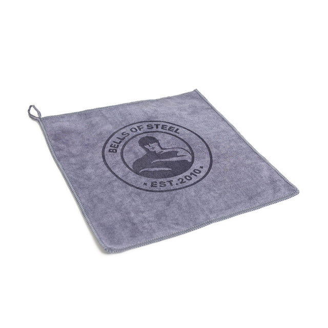 The Bells of Steel Barbell Cleaning Microfiber Towel is a gray, lint-free towel with stitched edges, a hanging loop, and features the "EST. 2010" logo—a perfect accessory for cleaning your barbell.