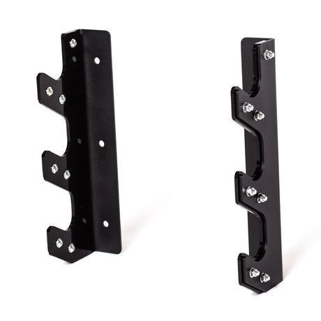 The Bells of Steel 3 Barbell Wall Rack is a black metal wall-mounted holder with notched hooks, multiple screw holes, and an HDPE plastic lining for secure barbell storage, shown against a white background.