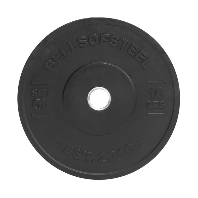 The Bells of Steel All-Black Bumper Plate is a black, 10-pound weight with a stainless steel insert for durability, accurate weight, "BELLSOFSTEEL" and "EST. 2010" labeling, and a central hole for barbell mounting.