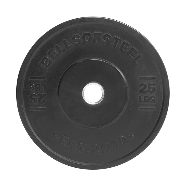 The All-Black Bumper Plate by Bells of Steel is a black rubber 25 lb plate with precise weight accuracy, "Bells of Steel" and "EST. 2010" engraved, and a central hole for barbell mounting.