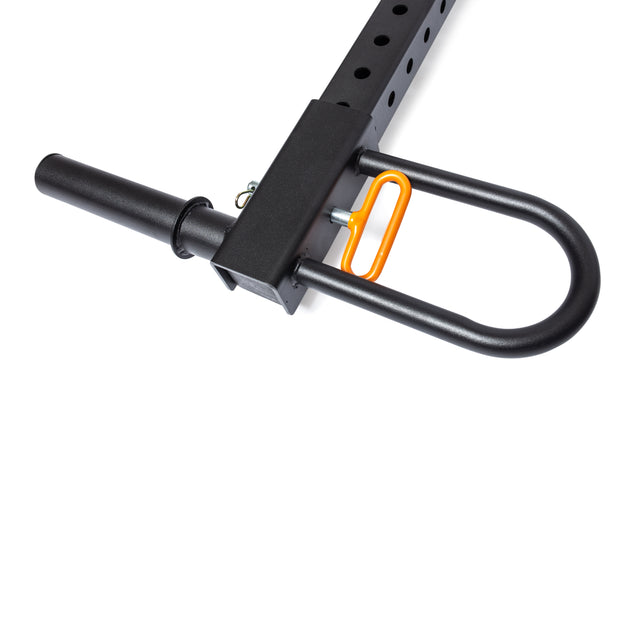 Close-up of a black metal Belt Squat / Lever Arms Rack Attachment by Bells of Steel, featuring lever arms and an orange locking pin, against a white background.