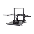 The Bells of Steel Belt Squat Machine is a black metal unit with a flat platform, two horizontal handles, an adjustable frame, and a hanging chain for weights—perfect for home gym lower body workouts, shown on a white background.