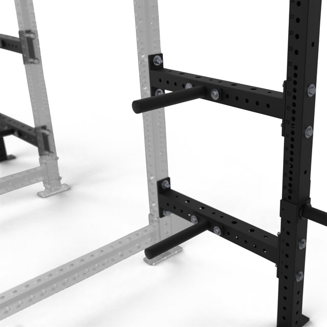 A close-up of the Bells of Steel Hydra Batwing Storage, a black metal power rack with 3x3 uprights and dual horizontal plate holders, set against a white background. Part of another modular gym rack appears in the background.