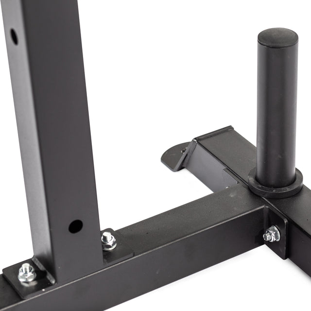 Close-up of the Bells of Steel Cable Crossover attachment for 2.3" x 2.3" racks, showing its black metal frame, bolts, vertical post, and horizontal bar with a cylindrical peg for weight plate storage.