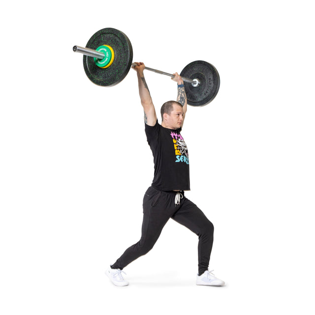 A person in athletic clothing performs a split jerk, holding a loaded barbell with Bells of Steel Urethane-Coated Change Plates overhead, one leg forward and one leg back, against a white background.