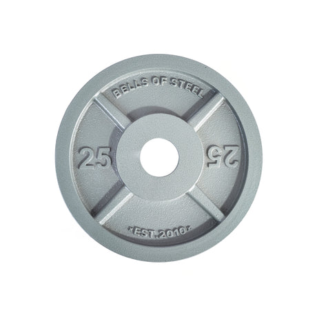 A round, gray 25-lb Machined Iron Olympic Weight Plate by Bells of Steel, featuring “BELLS OF STEEL” and “EST. 2010” embossed and a precision-fit center hole for secure use with barbells.
