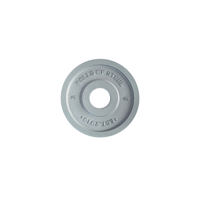 A gray Machined Iron Olympic Weight Plate by Bells of Steel, embossed with "BELLS OF STEEL," "EST. 2010," and "5." It features a precision central hole for easy loading onto Olympic bars.
