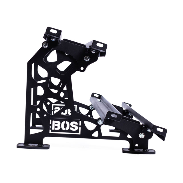 The Commercial Interchangeable Weight Rack - Components Only by Bells of Steel is crafted with a steel black metal frame featuring geometric cutouts and two inclined platforms. Designed for stability and support, it seamlessly accommodates commercial urethane dumbbells and proudly displays the "BOS" branding.