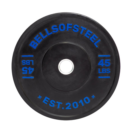 The Dead Bounce Conflict Bumper Plate by Bells of Steel is a black virgin rubber plate with blue "BELLSOFSTEEL," "45 LBS," and "EST. 2010" lettering, featuring a stainless steel insert and center opening for barbell use.