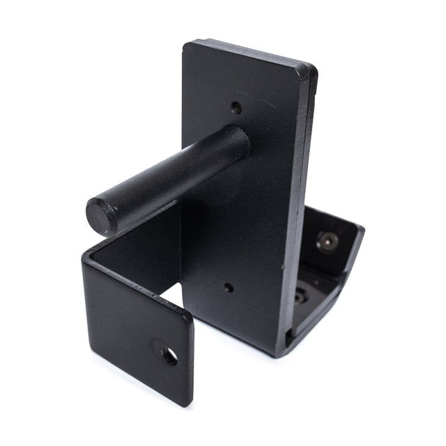 The Standard J-Cups by Bells of Steel are black metal wall mount brackets with cylindrical pegs and two flat mounting plates, designed like power rack J-Cups for securely holding or hanging objects.