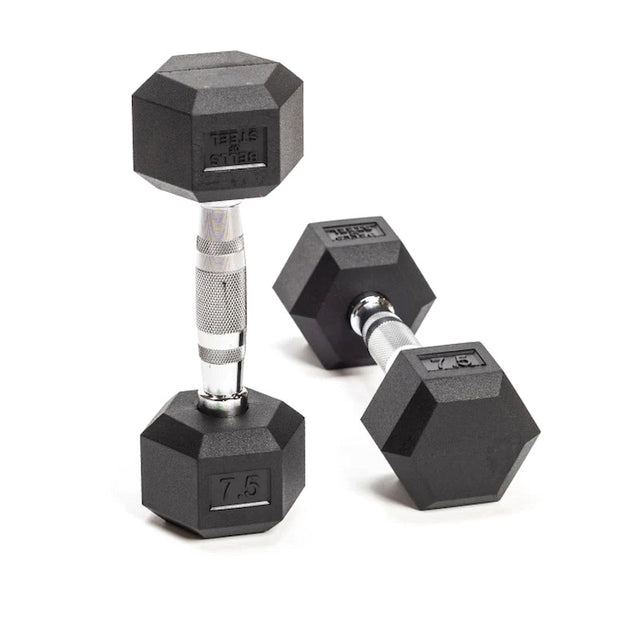 Two Ergo Rubber Hex Dumbbells by Bells of Steel, featuring chrome-plated handles, rest on a white surface. One dumbbell stands upright while the other lies flat, displaying a weight marking of 7.5.