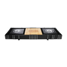 The Bells of Steel Weightlifting Platform is a rectangular black folding table with domino designs on the legs and corners, resembling a lifting platform. It has a wooden center tabletop with black sides displaying circular game-themed logos.