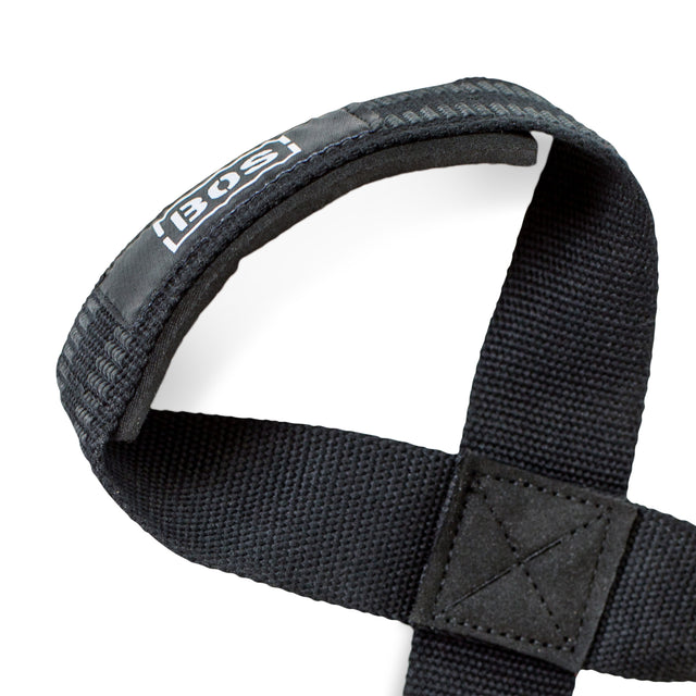 Close-up of a black, padded Classic Figure 8 Lifting Strap by Bells of Steel, featuring reinforced stitching and a branded tag. The strap is crossed in an X shape on a white background, designed to boost grip strength during lifts.