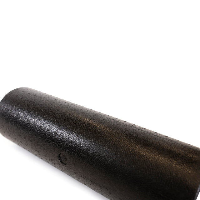 The Bells of Steel Foam Roller, in black high-density foam, is shown diagonally against a white background with most of the roller visible in the lower left—perfect for self-myofascial release.