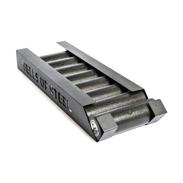A set of cylindrical steel weights in a black rack with "Bells of Steel" cut out on the side—ideal for pairing with your Bells of Steel Foam Roller Storage or wall-mounted gym setup.