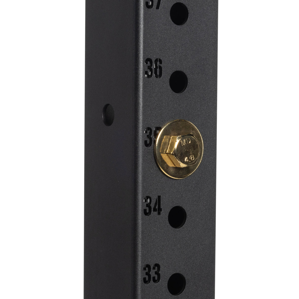 Close-up of a black metal 3x3 upright with numbered holes (33–37). Next to number 35, a Bells of Steel Gold/Black Titanized Bolt for Hydra is inserted.