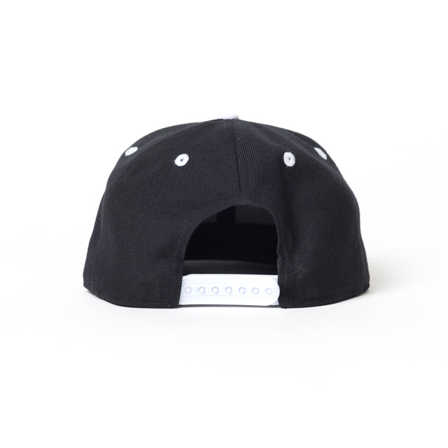 The Bells of Steel Snap Back Hat is shown from the back, with a white adjustable snapback closure and white embroidered eyelets.