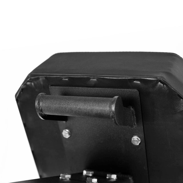 Close-up of the Bells of Steel Hero Heavy-Duty Weight Bench’s black padded seat with a textured grip handle and visible metal bolts; this bench supports up to 1,000 lbs.