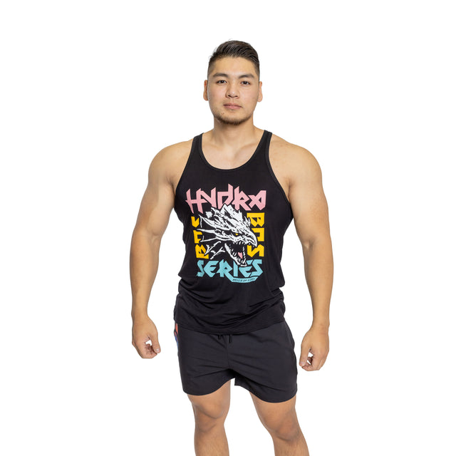A man faces forward in a Bells of Steel Bamboo Tank Top featuring a colorful Hydra BCS Series graphic, paired with black shorts, against a white background.