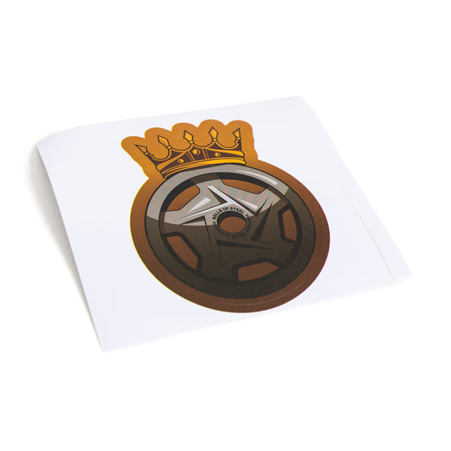 The Bells of Steel Stickers feature a die-cut car wheel with metallic details and a shining orange-yellow crown, set on a white background for a durable and stylish design.
