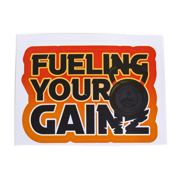 The Bells of Steel Stickers feature "FUELING YOUR GAINS" in bold yellow and black with an orange outline and a black kettlebell graphic. Made from durable vinyl, they're perfect for customizing gym gear or water bottles.