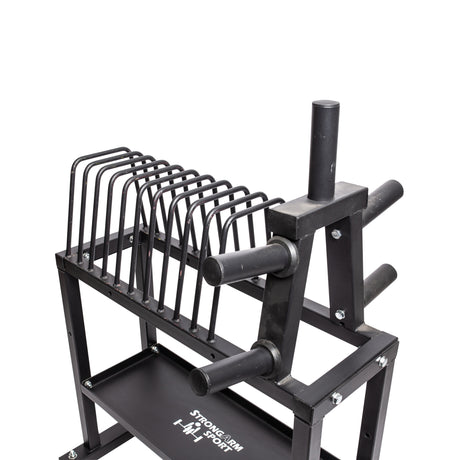 The Competition Plate Rack by Bells of Steel is a black storage solution featuring multiple slots for organizing weight plates and several pegs for holding barbells or other gym equipment. Perfect for powerlifters, this sturdy metal structure is designed to efficiently keep fitness gear organized.