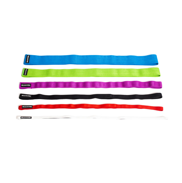 Five Bells of Steel Fabric Non-Slip Resistance Bands (41") in blue, green, purple, black, and red are laid flat in a row on a white background. Each band features a small black label at one end.