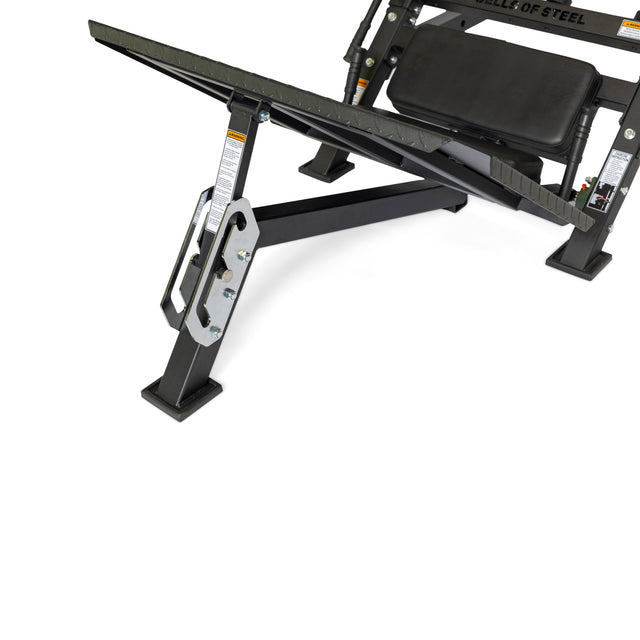 A close-up of a black adjustable weight bench set to a decline angle shows the padded seat and sturdy frame—perfect for pairing with the Bells of Steel 2-in-1 Iso Leg Press & Hack Squat Machine, The Juggernaut.