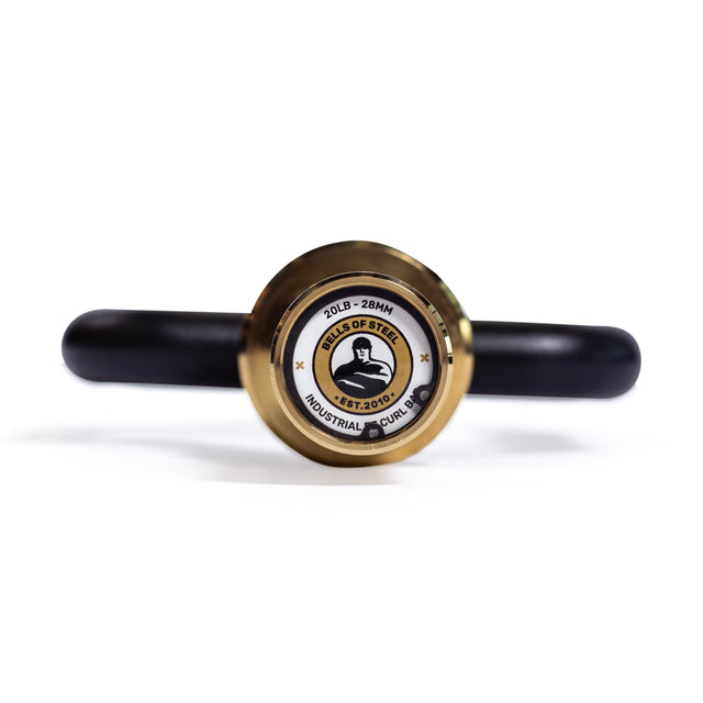 A close-up front view of a Tricep Bar endcap labeled "Bells of Steel," featuring a gold outer ring, black ergonomic handles, and rotating sleeves extending on each side.