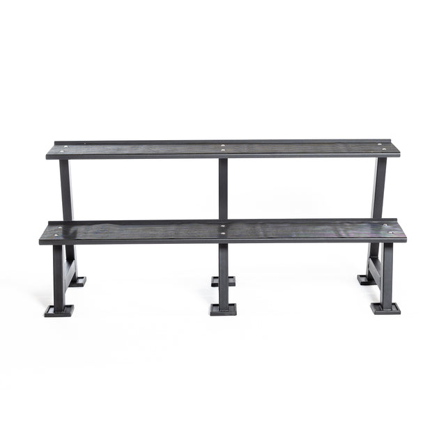 The Bells of Steel Kettlebell Rack is a two-tiered black metal bench with four square base supports, ideal for seating or storing kettlebells, shown against a plain white background.