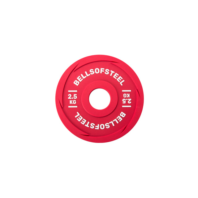 A Bells of Steel Urethane-Coated Change Plate, 2.5 KG, red with “BELLSOFSTEEL” in white twice around the center, is shown on a plain white background—crafted for durability in intense training.