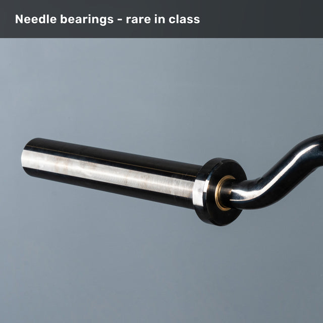 A close-up of the Bells of Steel Safety Squat Bar – The SS4 sleeve with a smooth metal finish highlights its needle bearing system. "Needle bearings—rare in class" is written above, perfect for your leg day training.