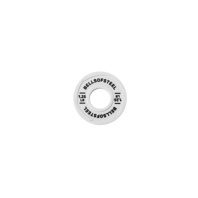 A Bells of Steel Urethane-Coated Change Plate, labeled 1.25 LB with brand printing, is photographed from above on a plain white background.