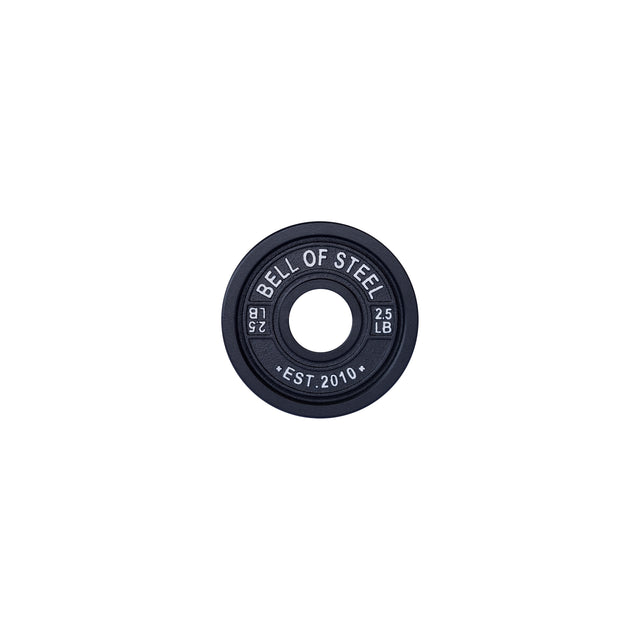 A black 2.5 lb plate by Bells of Steel, inscribed with "Bell of Steel" and "Est. 2010". It's a perfectly circular calibrated powerlifting plate with a central hole, ideal for intense barbell workouts.