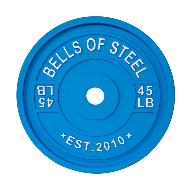 The blue Calibrated Powerlifting Plate from Bells of Steel features white text, "BELLS OF STEEL," "45 LB," and "EST. 2010." Its circular design with raised lettering makes it essential for weightlifting and gym exercises.