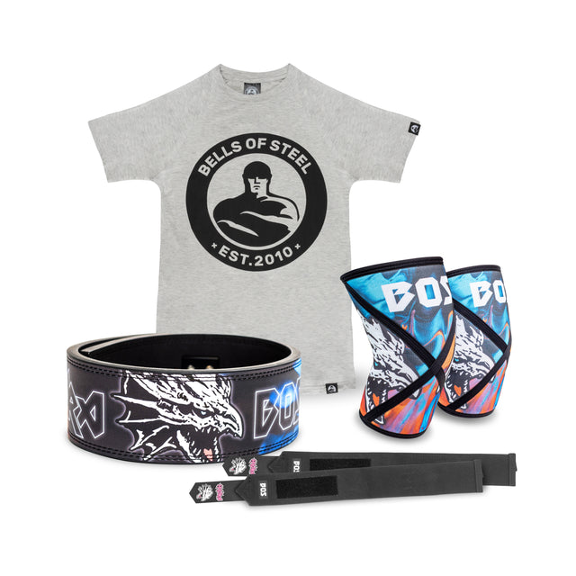 A Bells of Steel Lever Belt Package featuring a branded gray T-shirt, dragon-design lever belt, colorful knee sleeves, and two black lifting straps is shown on a white background.