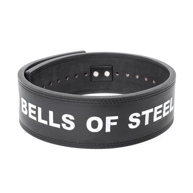 The Bells of Steel Lever Belt is a sturdy black leather lifting belt with "BELLS OF STEEL" in bold white letters, adjustment holes, and a robust metal lever buckle for secure support.