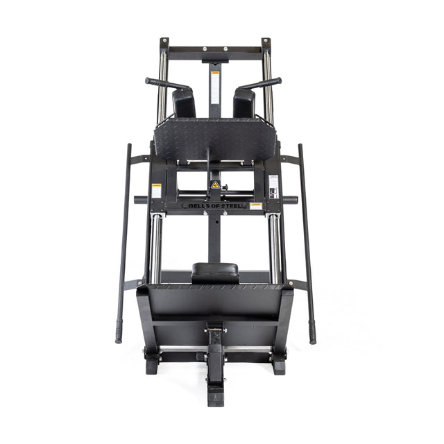 The Bells of Steel Leg Press Hack Squat Machine features padded shoulder rests, handles, and a footplate in a sleek black design—ideal for any home gym, shown from the front against a white background.