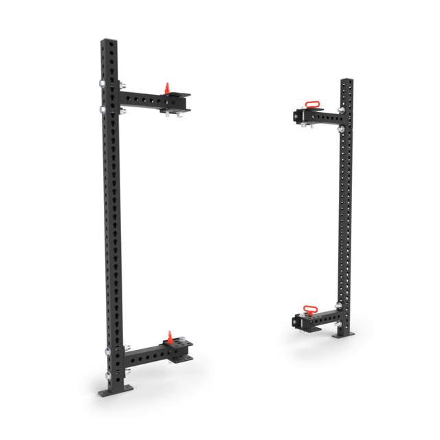 The Bells of Steel Manticore Folding Half Rack - Prebuilt (3" x 3", 1" holes) features two black modular uprights with multiple adjustment holes and red safety pins—perfect for any home gym rack setup.