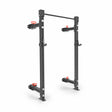 The Bells of Steel Manticore Folding Half Rack—3"x3" uprights with 1" holes, four red-handled safety arms, and a top pull-up bar—is a modular black power rack ideal for any home gym.