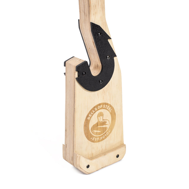 The Bells of Steel Meat Hook Deadlift Jack is a portable wooden gym accessory with a black metal hook, featuring the brand logo and kettlebell engraving—ideal for lifting bars and making deadlift setups easy and stylish.