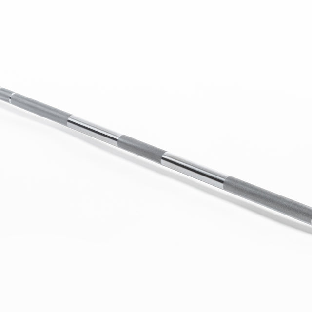 A close-up of the Bells of Steel Olympic Weightlifting Barbell, highlighting its textured grip, smooth chrome finish, and needle bearings, displayed diagonally on a white background.