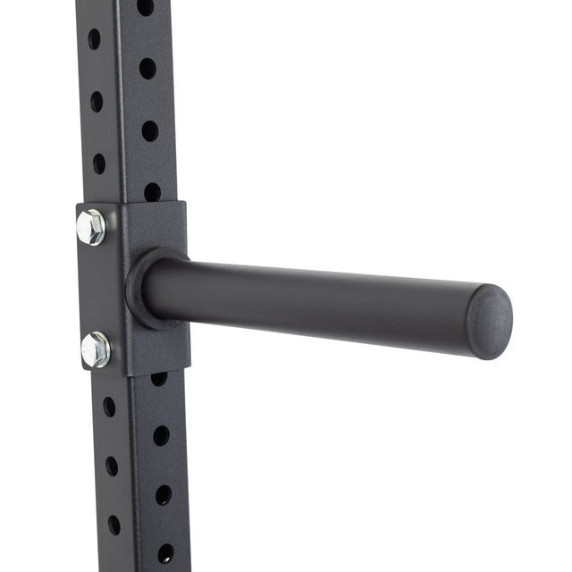 The Bells of Steel Wall-Mounted Plate Storage Rack features black metal weight pegs that attach securely to a vertical rack with multiple holes, providing efficient and organized weight plate storage for any home gym.
