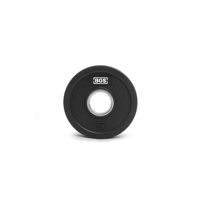 A black weight plate from Bells of Steel, rubber-coated and made of iron, features a central silver hub with "BOS" at the top and the number "5" at the bottom for its 5 kg weight. It rests against a plain white background, emphasizing its sleek design.