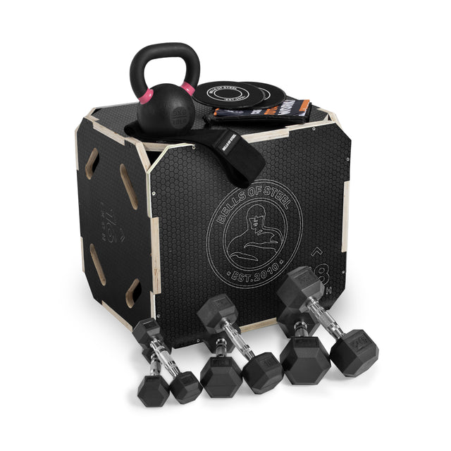 The Bells of Steel Strength Circuit Starter Kits include a black plyometric box displaying the logo, kettlebell, resistance band, exercise sliders, booklets, and four hex dumbbells—everything for your home workout on a white background.