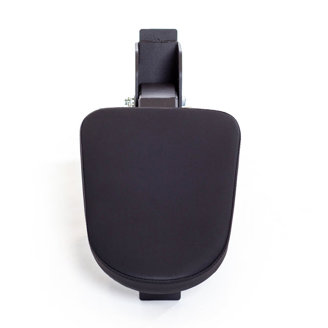 A top-down view of the Bells of Steel Seal Row Pad Rack Attachment—a black, padded armrest with a rectangular mounting bracket—resembles a chest support pad and is isolated on a white background.