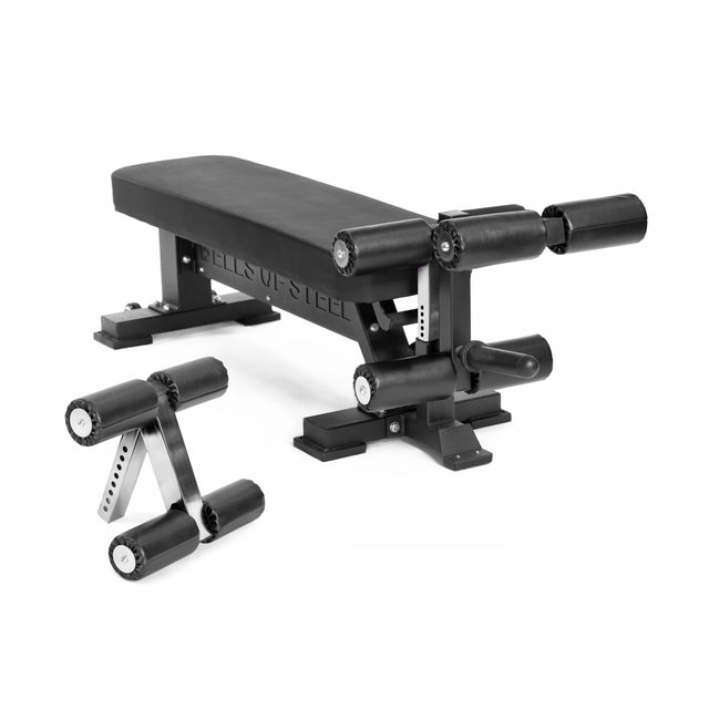 The Bells of Steel Hero Heavy-Duty Weight Bench in black, featuring padded rollers and a separate small roller attachment, is designed for effective strength training exercises.